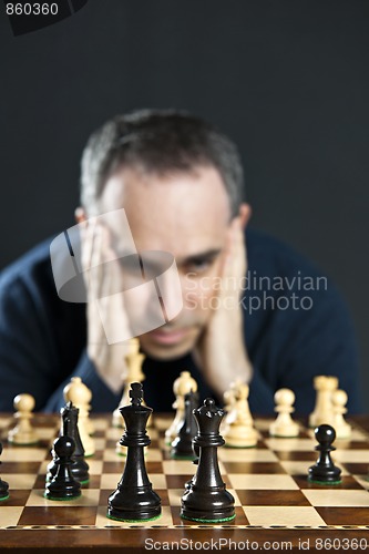 Image of Man at chess board