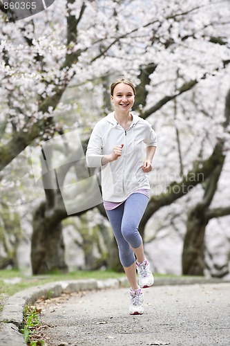 Image of Girl jogging in park
