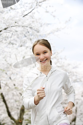 Image of Girl jogging in park