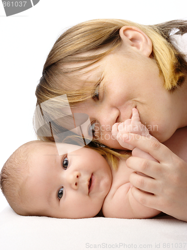 Image of Mother kissing her child's hand
