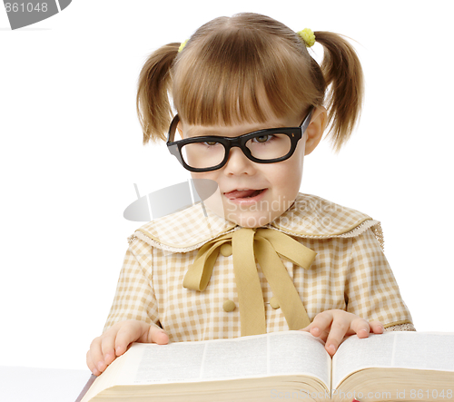 Image of Happy little girl with book wearing black glasses