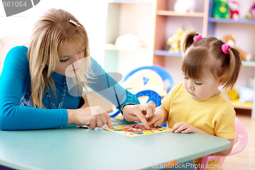 Image of Teacher and child in preschool