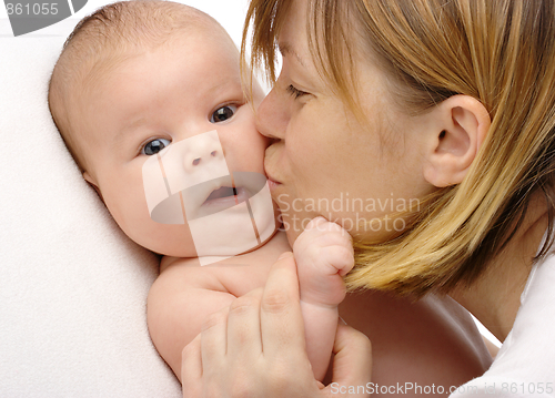 Image of Mother kissing her child