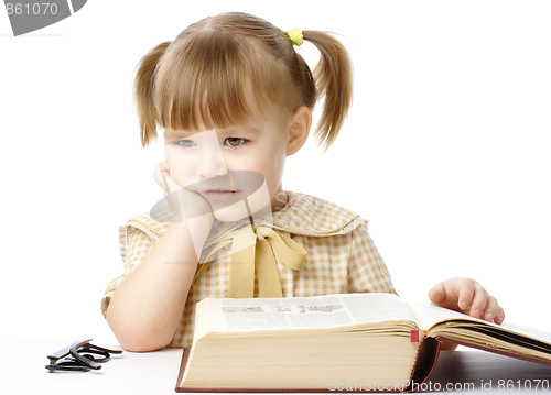 Image of Cute little girl with book, back to school