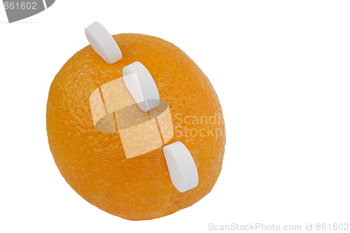 Image of Orange with vitamin C tablets