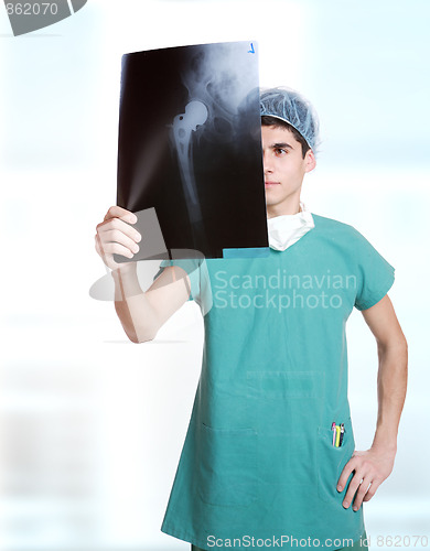 Image of doctor holding up xrays.