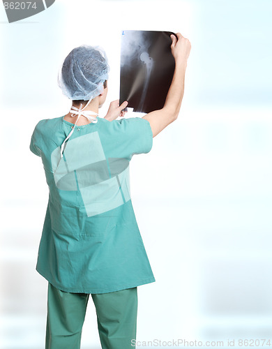 Image of doctor holding up xrays.