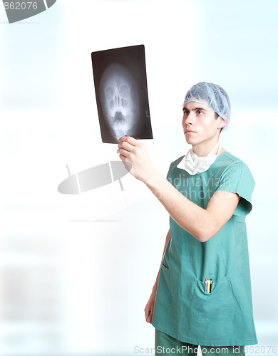 Image of doctor holding up xrays.
