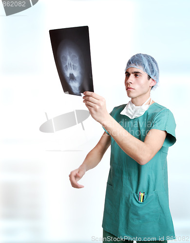 Image of doctor holding up xrays.