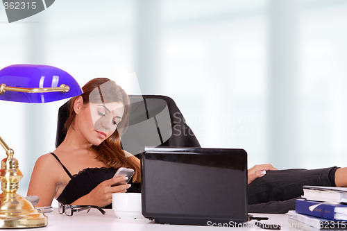 Image of young business woman standing