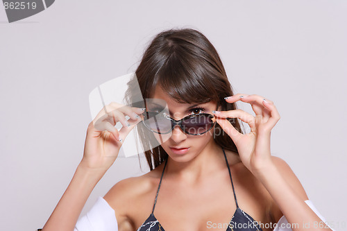 Image of tanned woman portrait with sunglasses
