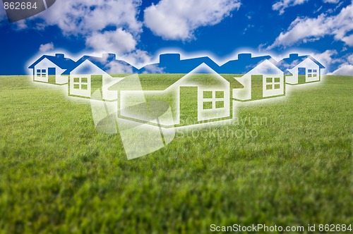 Image of Dreamy Houses Icon Over Grass Field and Sky
