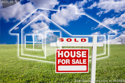 Image of Sold For Sale Sign Over Clouds, Grass, Sky and House Icon.