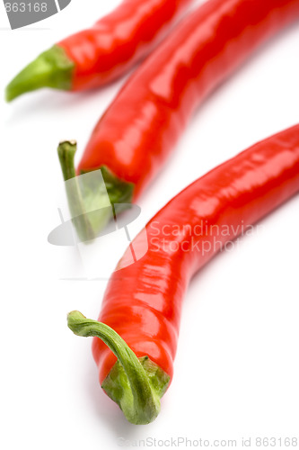 Image of three red chili peppers