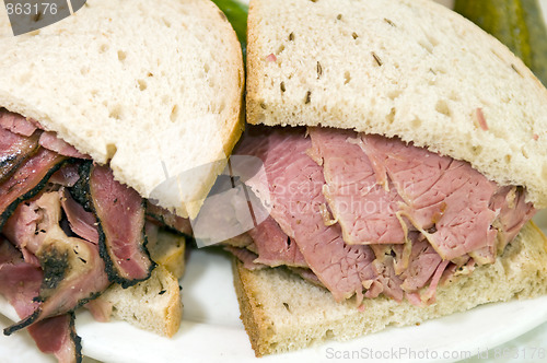 Image of combination pastrami corned beef on rye sandwich