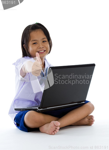 Image of schoolgirl with laptop and thumb up