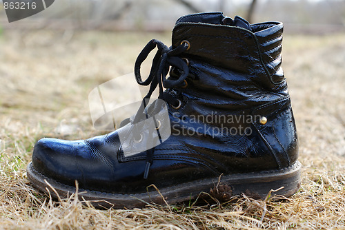 Image of dirty black boot