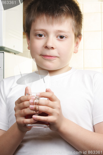 Image of Boy in white with tea