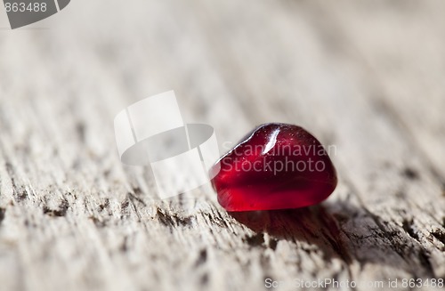 Image of Pomegranate aril on wooden board