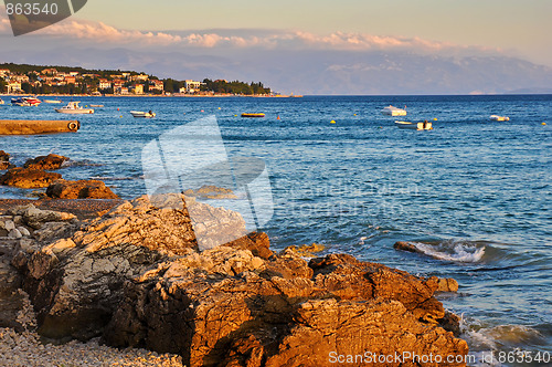 Image of Motor Boats on the Water at Sunset on the Background of Mountain