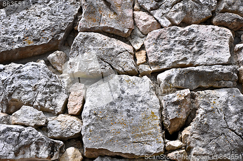 Image of close up texture of grey stone with cracks