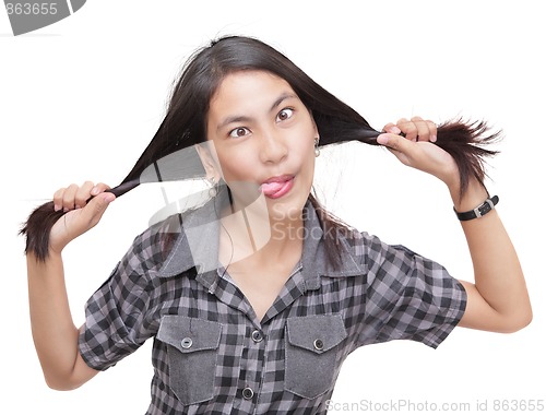 Image of Crazy humorous girl pulling braids