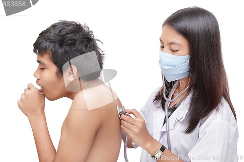 Image of Doctor diagnosing coughing patient