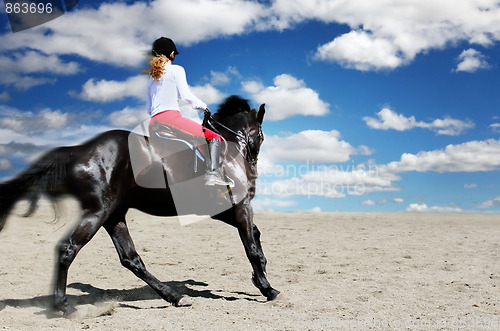 Image of Teenage girl horseback riding