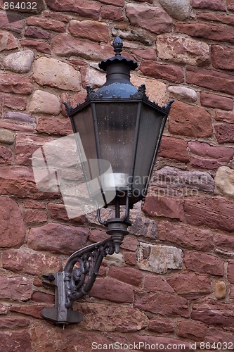 Image of Part of the old city wall with lantern in Ladenburg, Germany