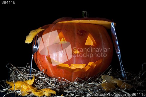 Image of Halloween Pumpkin, inside lit by light, creepy looking

