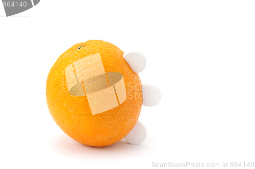 Image of Orange with vitamin C tablets