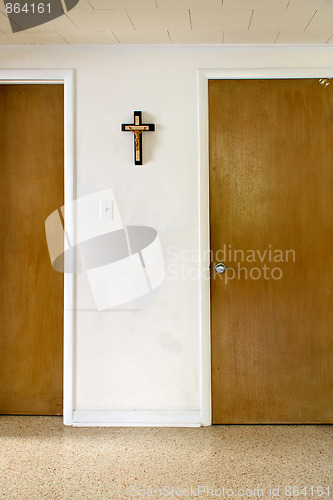 Image of wall with cross and doors
