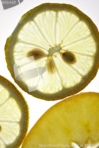 Image of Sliced Lemon and Apple isolated on white