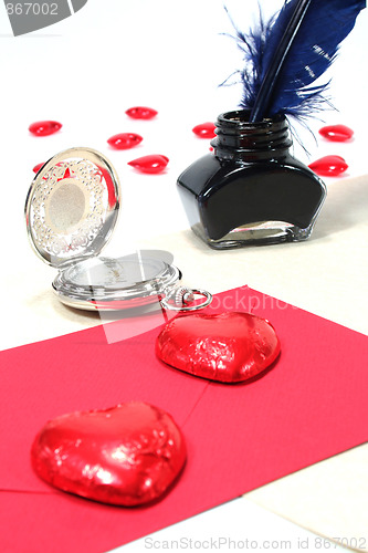 Image of Red hearts with pen and ink, and Clock