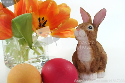 Image of Easter bunny with Easter eggs and tulips