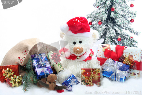 Image of Teddy with a lot of Christmas presents