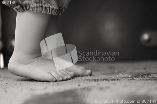 Image of Toddler standing up on his toes