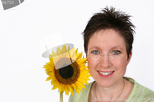 Image of Woman's face and a sunflower