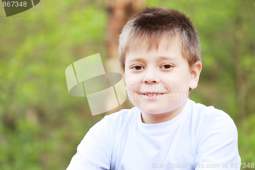 Image of Smiling boy in forest