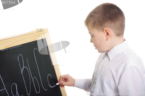 Image of Boy writing on blackboard