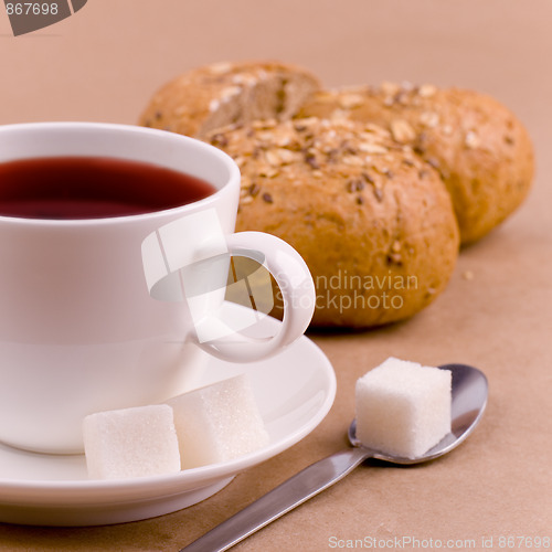 Image of cup of tea, sugar and bread