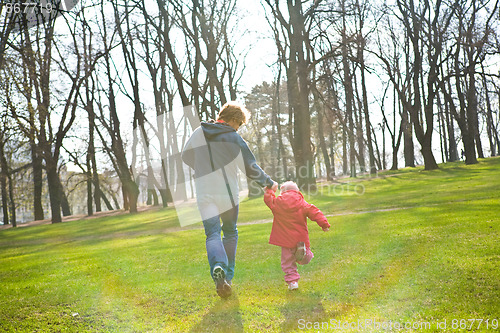 Image of Father and daughter running