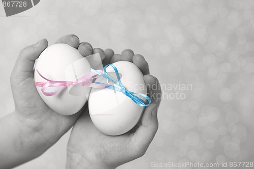 Image of Children hands holding  Easter Eggs