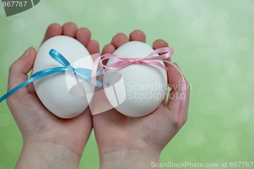 Image of Children hands holding  Easter Eggs