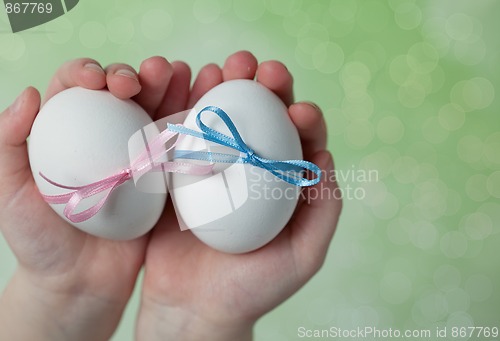 Image of Children hands holding  Easter Eggs