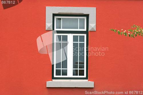 Image of window in red wall