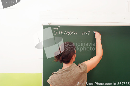 Image of teacher on the blackboard