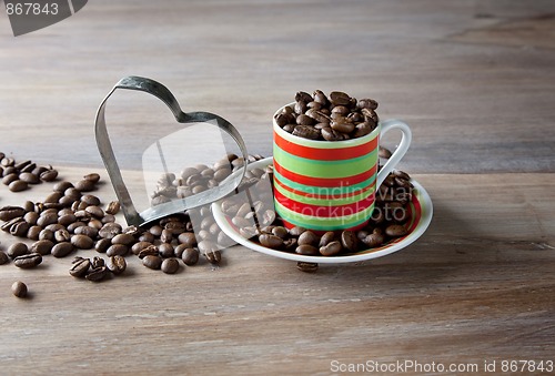 Image of Coffee beans in striped cup