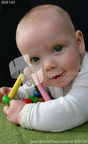 Image of Baby with rattle