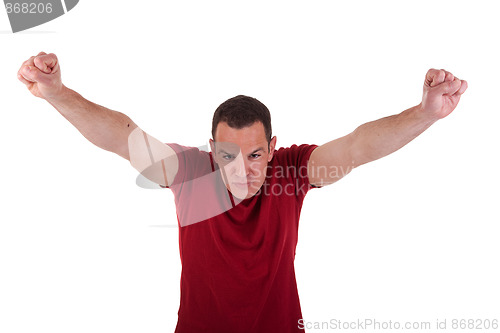 Image of Portrait of a happy  man with his arms raised